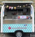 Colourful crepe trailer with pennant 